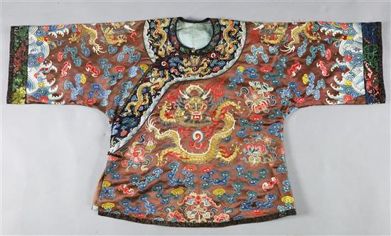 A Chinese embroidered silk and gold thread dragon jacket, late Qing dynasty, alterations